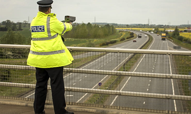 Police with speed camera motorway